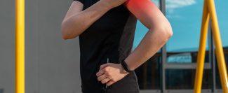 athlete-touching-painful-shoulder-with-red-point-during-outdoor-training-dislocation-arthritis-fracture-rotator-cuff-strain-consequences-health-problems-sport-concept-min